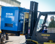 SDMO generator being loaded by forklift on to a flatbed